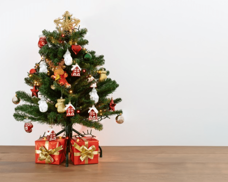 Transform Your Home into a Winter Wonderland with an Artificial Green Christmas Tree and Flocked Decorations: Delightful Ideas for Creating Lasting Memories This Holiday Season.